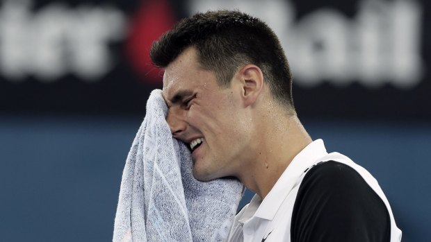 Bernard Tomic had to battle in hot and humid conditions in Brisbane to defeat Kei Nishikori.