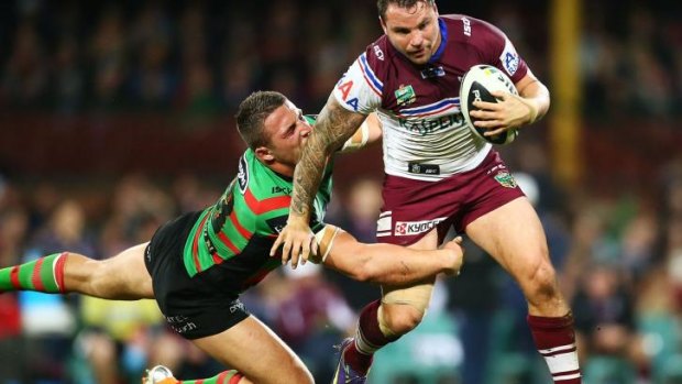 Going nowhere: Sam Burgess gets to grips with Anthony Watmough.