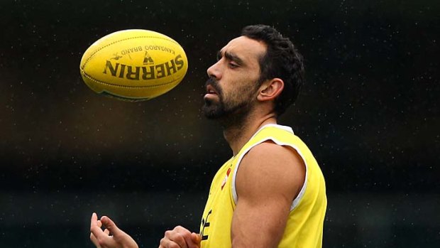Adam Goodes handballs during a training session at the SCg yesterday.