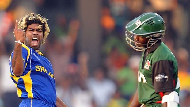 Lasith Malinga celebrates after claiming his second World Cup hat-trick when he dismissed Shem Ngoche of Kenya.