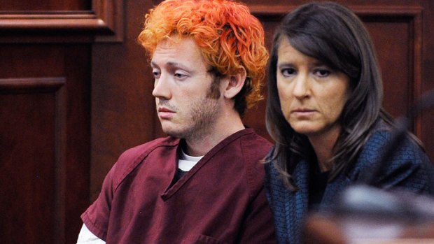 Bragged about prostitutes... James Holmes appears at the Arapahoe County Courthouse with his lawyer this week.