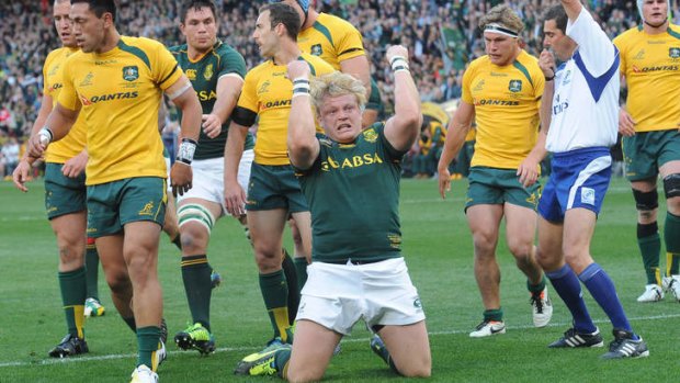 Unremarkable: Adriaan Strauss of the Springboks celebrates scoring a try against the Wallabies.