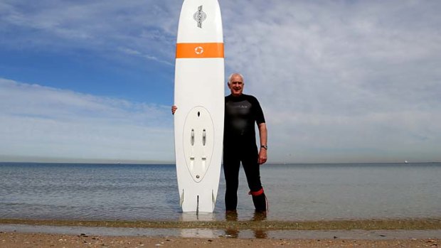 Board or boat? Daryl Foulds, 66, who rides one of the battery-powered WaveJet surfboards in Port Phillip Bay, says his motoring speed is no faster than a longboarder paddling.