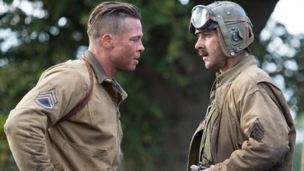 Brothers in arms: Brad Pitt (left) and Shia LaBeouf take the hard road to Germany in WWII drama <i>Fury</i>.