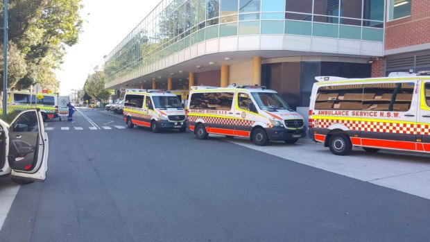 Severe delays: An ambulance queue 13 deep at Liverpool Hospital recently.