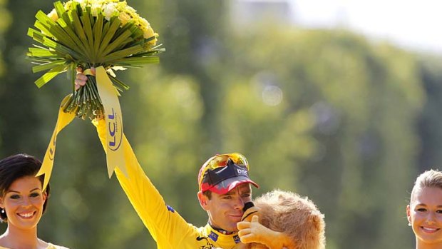 Dream come true ... Cadel Evans acknowledges the crowd after winning the Tour de France.