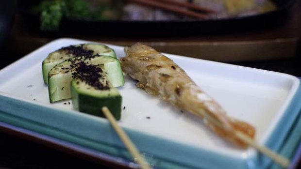 Kushiyaki ... zucchini skewer sprinkled with dried shiso leaf and a wholly edible prawn skewer.