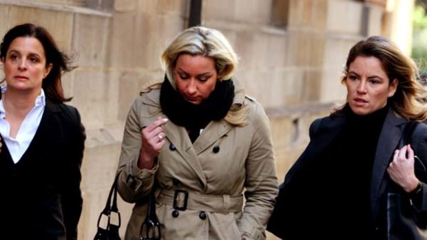 Under pressure ... Keli Lane (middle) arrives for the first day of her trial in August.