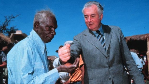 PM Gough Whitlam pours sand into the hand of Vincent Lingiari in 1975. Lingiari's descendants will attend Wednesday's memorial for Whitlam.