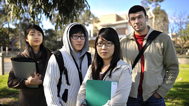 International students (from left) Seonah Kim, Lee Hee Jin, Lee Naree and Moustafa Ibrahim, outside Hawthorn-Melbourne College, are unhappy with the way they have been treated.