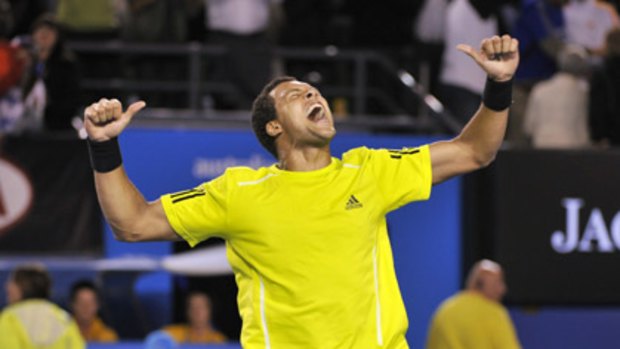 Jo-Wilfried Tsonga celebrates in fine style after a gruelling five-setter against Novak Djokovic.