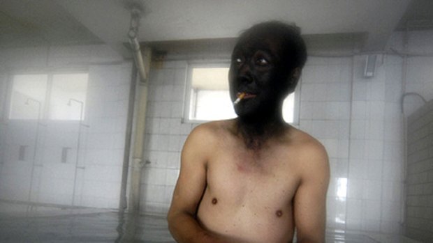 A coalminer takes a bath after finishing his shift at a mine in northern China's Shanxi province.
