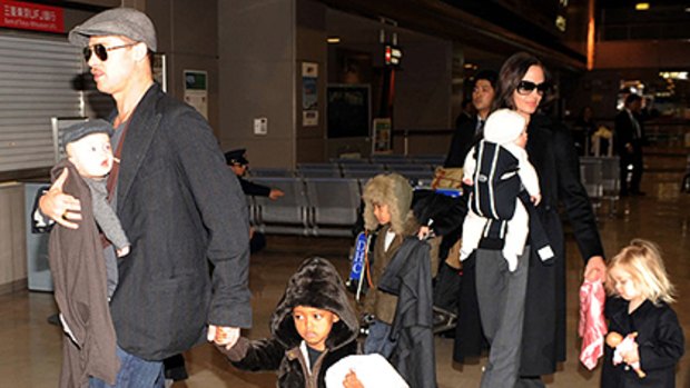 Brangelina brood ... Brad and Angelina in Japan with their six children.