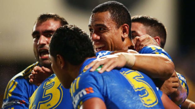 Will Hopoate celebrates teammate Vai Toutai's try.