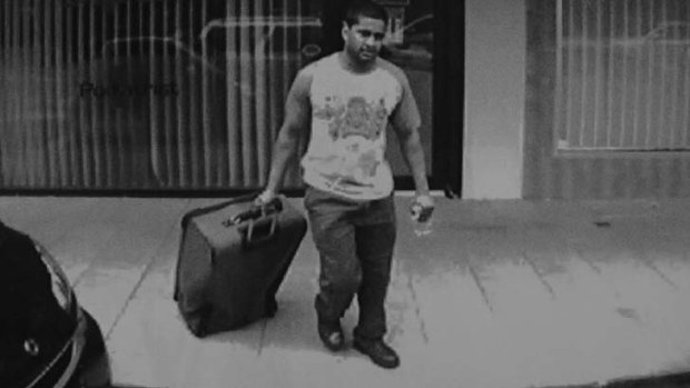Daniel Stani-Reginald wheels a suitcase containing the body of his murder victim Tosha Thakkar.