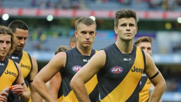 Trent Cotchin leads the Tigers from the field.