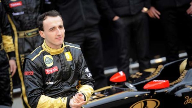 Polish driver Robert Kubica poses during the presentation of the new Lotus Renault GP R31.