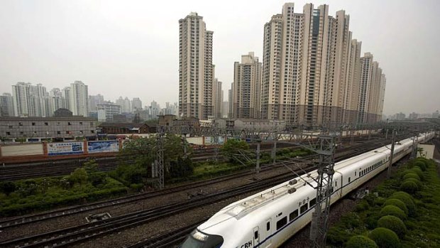 A bullet train arrives at the northern Shanghai Railway Station.
