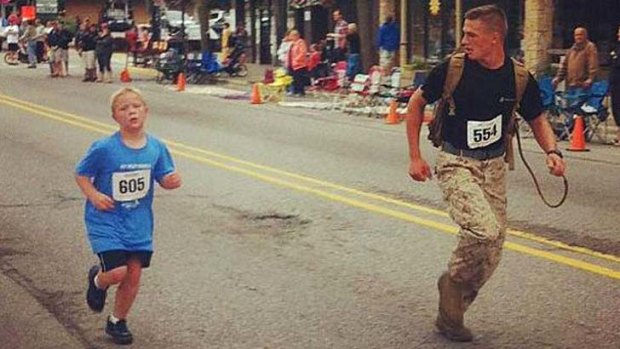 Stopping to help: Lance Corporal Myles Kerr encourages Boden Fuchs.