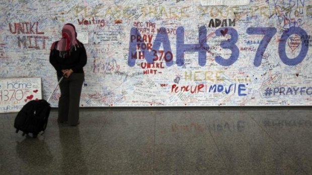 Captivating mystery: Messages for passengers aboard the missing Malaysia Airlines plane at Kuala Lumpur International Airport.