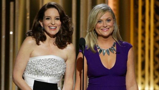 Golden Globes co-hosts Tina Fey, left, and Amy Poehler did not hold back in their final gags.
