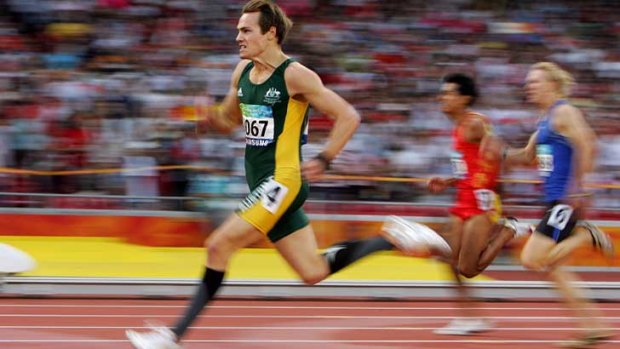 Champion: Evan O'Hanlon runs in the Beijing Paralympics in 2008. He won three gold medals and set two world records.