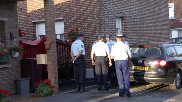 French police inspect the house of a couple who have been arrested over the discovery of eight babies' bodies.