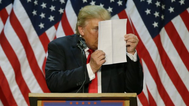 "There's nothing to learn from them," Donald Trump said of his tax returns. Here, he stares at a sheet of talking points and notes as he mocks critics who say he uses prepared speeches or teleprompters during a rally on May 6 2016. 