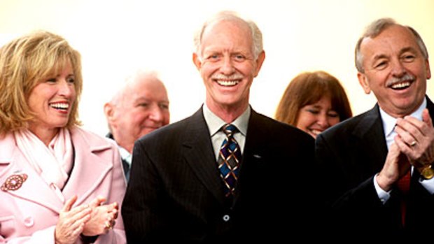 Chesley 'Sully' Sullenberger, the US Airways pilot who landed in New York's Hudson River, smiles during a homecoming celebration in Danville, California. Applauding him are his wife Lorrie Sullenberger, left, and Danville Mayor Newell Arnerich.