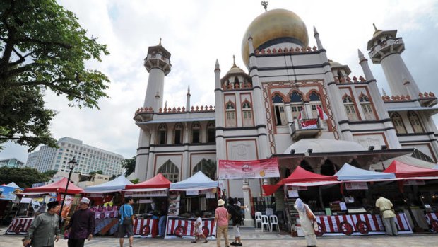 Vendors selling Muslim food during the month of Ramadan in front of the Sultan mosque in Singapore. Spending by Muslim tourists is growing fast.