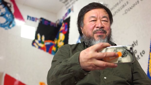 Ai Weiwei takes a selfie in the Lego installation at the National Gallery of Victoria.