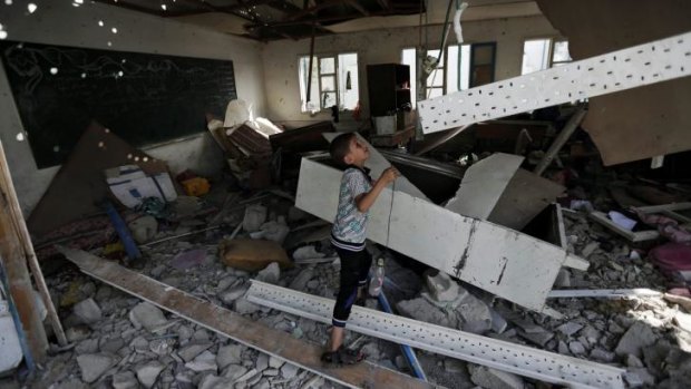 A child in a classroom at the UN school in Jebaliya, Gaza,  that was shelled.