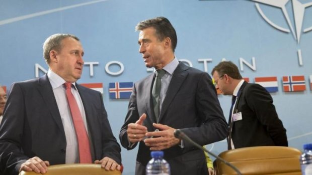NATO Secretary General Anders Fogh Rasmussen speaks with Ukraine's Foreign Minister Andriy Deshchytsia (left) before a NATO-Ukraine Commission meeting at the NATO headquarters in Brussels. 