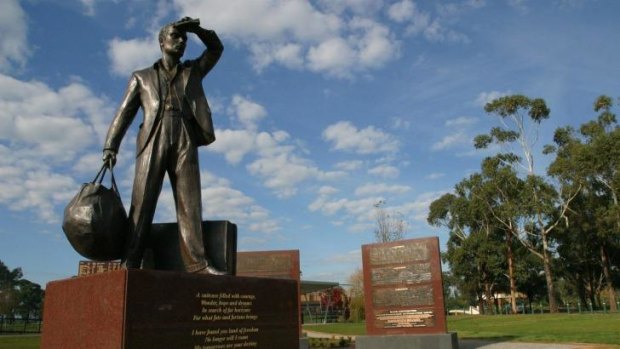 Sturdy figure: A striking bronze statue is the central figure of the Wall of Recognition at the Gippsland Immigration Park at Morwell.