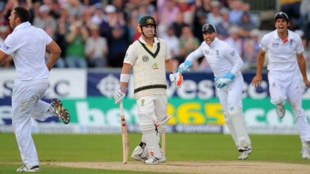 David Warner looks on as (from left) Tim Bresnan, Matt Prior and Alastair Cook celebrate his dismissal during day four of fourth Ashes Test at Durham.