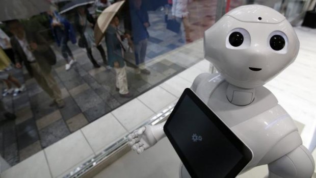 New face: "Pepper" at work in a branch of SoftBank in Tokyo.
