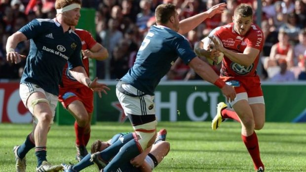 Former Wallabies winger Drew Mitchell takes on the Munster defence.