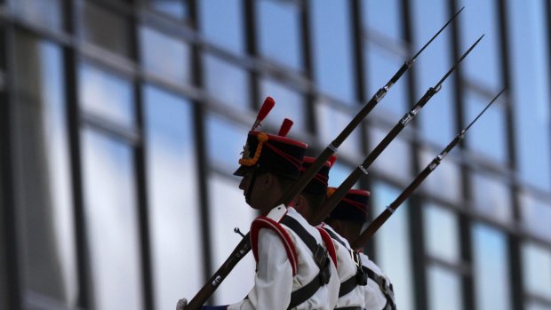 Presidential guard soldiers march up the ramp of the Planalto Presidential Palace, in Brasilia, on Monday.