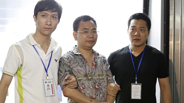 Lin Chunping is detained by police in east China's Zhejiang province earlier this month.