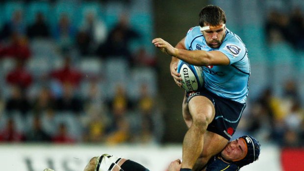 Brumbies skipper Ben Mowen brings down NSW's Chris Alcock on Saturday night. ACT great George Gregan says the club's ability to 'win ugly' will put them in good stead in the Super Rugby finals.