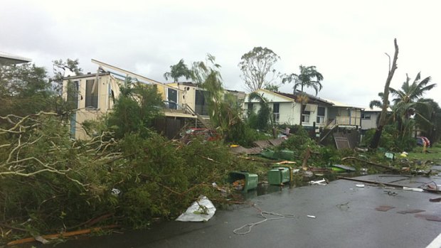 A freak storm that hit Townsville this morning has been described as a 'mini-tornado'.