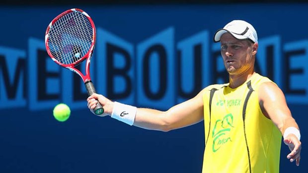 Lleyton Hewitt plays a forehand during a practice session at Melbourne Park on Monday.