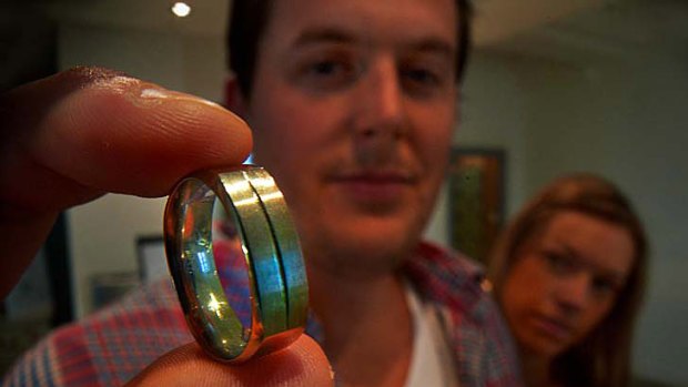 Nic Sal tries on mens wedding rings with partner Michelle Fox at Simon West jewellers.
