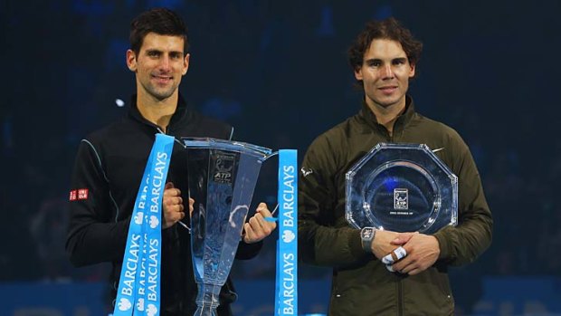 Champion Novak Djokovic (L) of Serbia and runner-up Rafael Nadal of Spain.