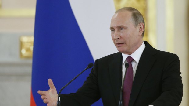 Vladimir Putin addresses Russian athletes at the Kremlin.