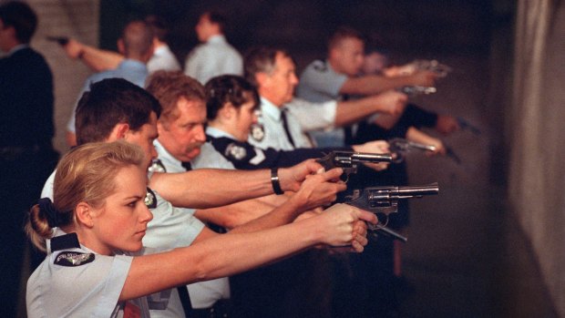 A policewoman pictured with colleagues at a pistol range in 1995.