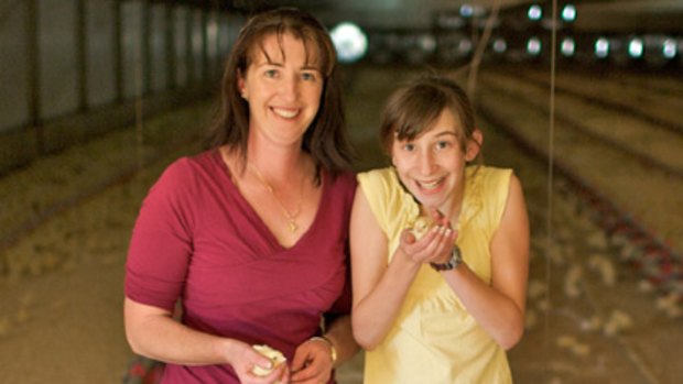 Birds in their hand... Cathy Muscat with her daughter, Stephanie, 11, at their Cawdor farm.