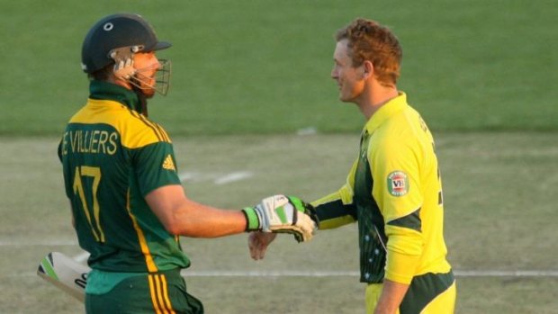 Australia captain George Bailey (right) concedes defeat to South Africa captain A B de Villiers during their match in the one-day international tri-series. 