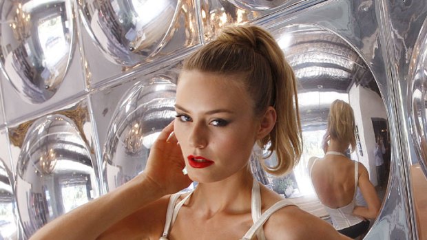 Collapsed cups ... sign that a bra is too big. Model wears Madonna-inspired conical bra.