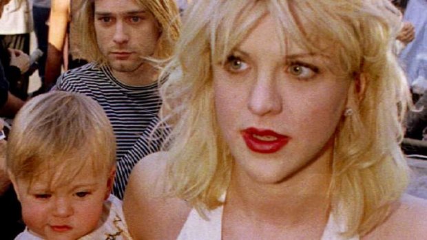 Musical of their life ... Courtney Love with Kurt Cobain, holding their daughter Frances Bean Cobain, in 1992.